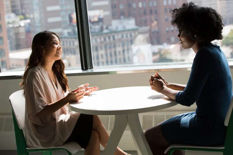 Women discussing pregnancy